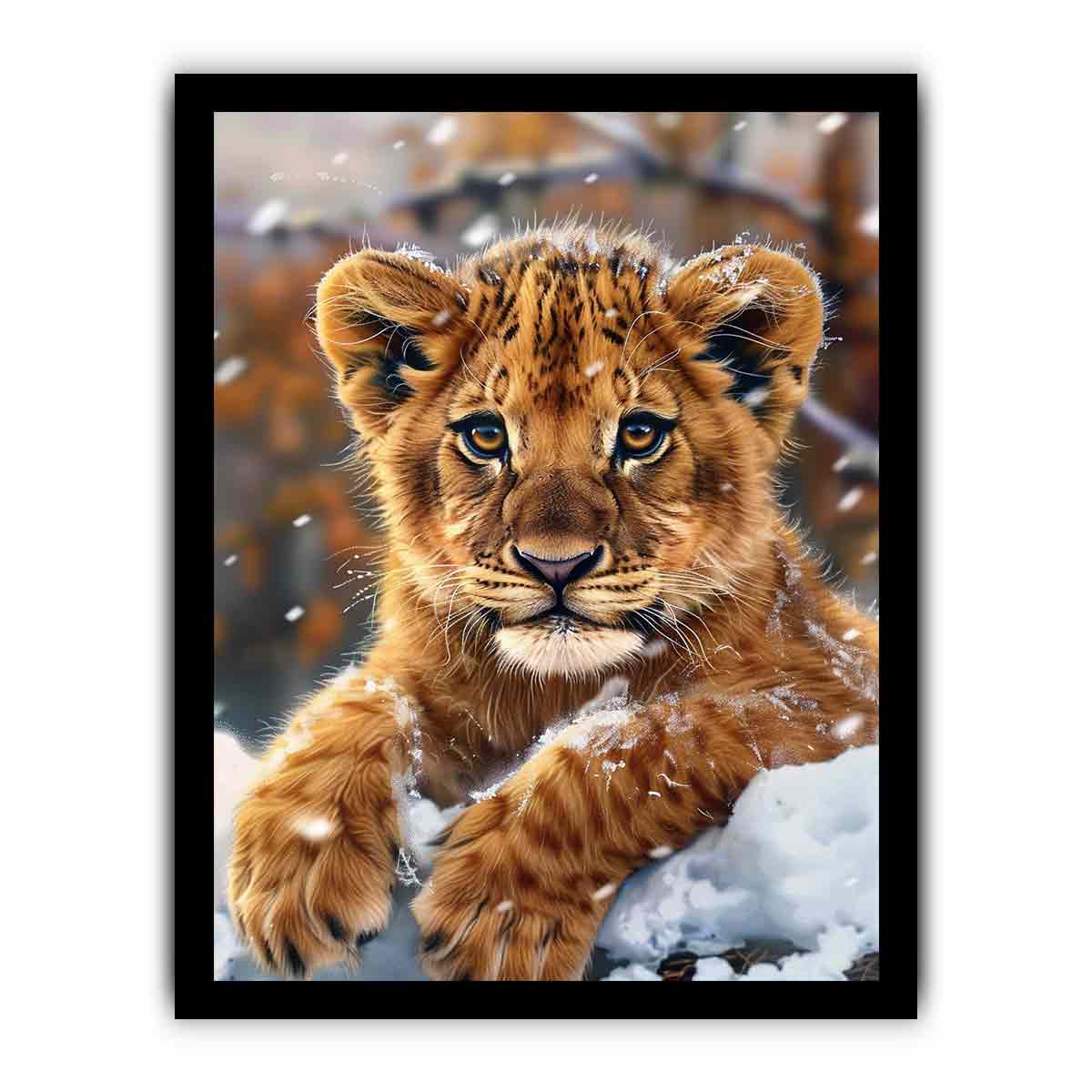 Young lion cub resting in snow with soft falling flakes for modern nurseries decor.