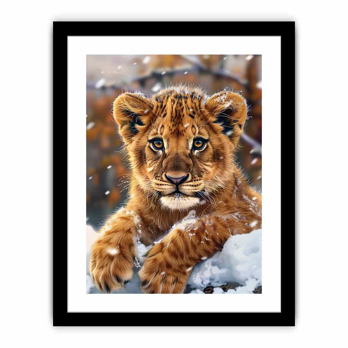 Young lion cub resting in snow with soft falling flakes for modern nurseries decor.