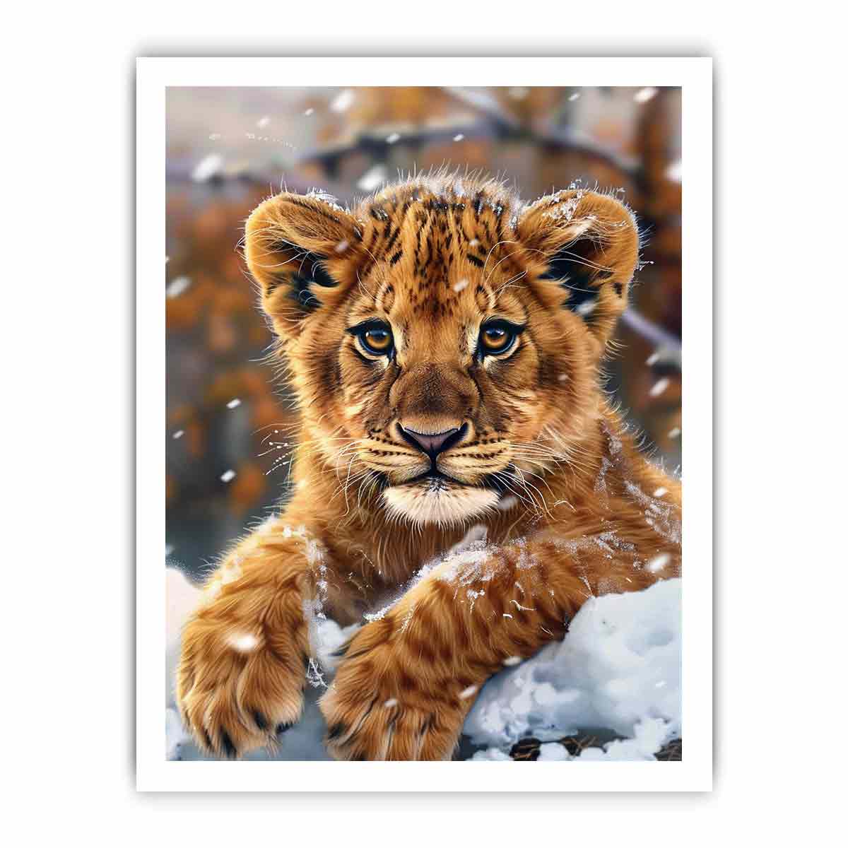 Young lion cub resting in snow with soft falling flakes for modern nurseries decor.
