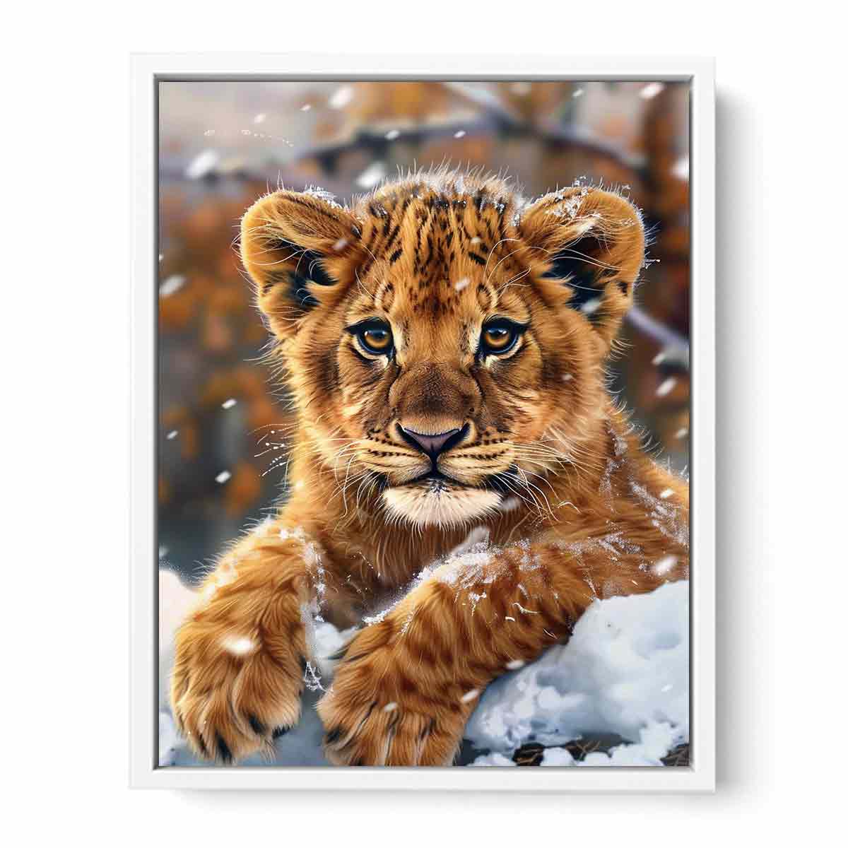 Young lion cub resting in snow with soft falling flakes for modern nurseries decor.