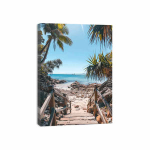 Vertical coastal beach stairs canvas print with palms and ocean for entryway decor.