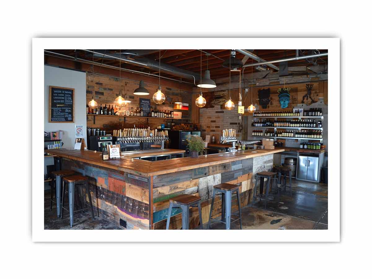 Rustic industrial bar interior canvas print for home bar decor.