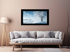 Snowy winter tree landscape canvas art for serene blue and white living room decor.